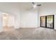 Spacious bedroom with carpet, high ceilings, ceiling fan, and access to the backyard at 3629 Laguna Verde Way, Las Vegas, NV 89121