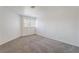 Bright bedroom featuring carpet, window and neutral walls at 3629 Laguna Verde Way, Las Vegas, NV 89121