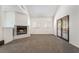 Sun-filled living room with plush carpeting, a modern fireplace, expansive windows and access to the outdoors at 3629 Laguna Verde Way, Las Vegas, NV 89121