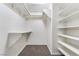 Spacious walk-in closet featuring custom shelves and ample storage space at 3629 Laguna Verde Way, Las Vegas, NV 89121