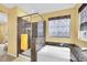 Luxurious bathroom with a tub, marble enclosed shower, and decorative window treatments at 3741 Via Gaetano, Henderson, NV 89052