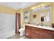 Well-lit bathroom with double sink vanity, shower/tub combo, and modern fixtures at 3741 Via Gaetano, Henderson, NV 89052