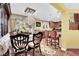 Open concept dining room with views of kitchen and backyard at 3741 Via Gaetano, Henderson, NV 89052