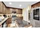 Eat-in kitchen featuring stainless appliances, an island, and granite countertops at 3741 Via Gaetano, Henderson, NV 89052