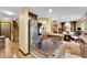 Eat-in kitchen with island, stainless appliances and access to dining room at 3741 Via Gaetano, Henderson, NV 89052