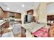 Kitchen with stainless appliances, island, breakfast bar and granite countertops at 3741 Via Gaetano, Henderson, NV 89052