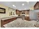 Spacious kitchen featuring stainless appliances, breakfast bar, and island at 3741 Via Gaetano, Henderson, NV 89052