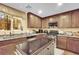 Well-equipped kitchen with island, stainless appliances, and granite countertops at 3741 Via Gaetano, Henderson, NV 89052