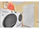 Bright laundry area with white washer, dryer, and ample storage; functional and modern at 3741 Via Gaetano, Henderson, NV 89052