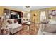 Elegant living room with rich hardwood floors, custom built-ins, chandelier, and neutral-toned furnishings at 3741 Via Gaetano, Henderson, NV 89052