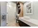 Modern bathroom with glass shower, open shelving, decorative mirror, and sink on countertop at 3750 S Las Vegas Blvd # 4507, Las Vegas, NV 89158