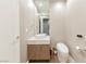 Modern powder room with wall hung toilet, granite countertop and decorative mirror at 3750 S Las Vegas Blvd # 4507, Las Vegas, NV 89158