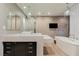 Elegant bathroom featuring a modern vanity, soaking tub, and stylish lighting fixtures at 3750 S Las Vegas Blvd # 4507, Las Vegas, NV 89158