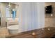 Spa-like main bathroom featuring a soaking tub behind a privacy screen and natural wood table at 3750 S Las Vegas Blvd # 4507, Las Vegas, NV 89158