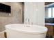 Luxurious soaking tub with chrome fixtures and a serene view, creating a spa-like retreat at 3750 S Las Vegas Blvd # 4507, Las Vegas, NV 89158