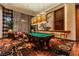 Elegant game room with a pool table under pendant lighting and designer carpet at 3750 S Las Vegas Blvd # 4507, Las Vegas, NV 89158