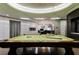 Game room with pool table opening to a kitchen with bar stool seating at 3750 S Las Vegas Blvd # 4507, Las Vegas, NV 89158