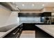 Contemporary kitchen with dark cabinets, stainless steel appliances, and a sleek, modern design at 3750 S Las Vegas Blvd # 4507, Las Vegas, NV 89158