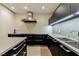 Modern kitchen featuring sleek black cabinets and stainless steel appliances, with an island at 3750 S Las Vegas Blvd # 4507, Las Vegas, NV 89158