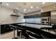 Modern kitchen with dark cabinets, stainless steel appliances, and a bar stool seating at the island at 3750 S Las Vegas Blvd # 4507, Las Vegas, NV 89158