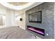 Stylish primary bedroom with a view of the ensuite bathroom, flat screen TV and electric fireplace at 3750 S Las Vegas Blvd # 4507, Las Vegas, NV 89158