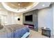 Sleek primary bedroom with a striking ceiling fan, electric fireplace, and expansive windows at 3750 S Las Vegas Blvd # 4507, Las Vegas, NV 89158