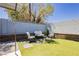 Backyard seating area featuring synthetic grass, perfect for outdoor entertainment at 4492 Rita Dr, Las Vegas, NV 89121