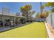 Expansive backyard with synthetic grass, offering ample space for outdoor activities and relaxation at 4492 Rita Dr, Las Vegas, NV 89121