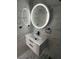Modern bathroom featuring dual LED mirrors, vanity sink and elegant marble-look tiling at 4492 Rita Dr, Las Vegas, NV 89121
