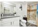 Well-lit bathroom featuring a modern vanity, updated fixtures, and a tiled shower at 4492 Rita Dr, Las Vegas, NV 89121