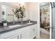 Modern bathroom featuring double sinks, stylish vanity, and a shower with decorative curtain at 4492 Rita Dr, Las Vegas, NV 89121