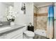Bathroom featuring a modern vanity, updated fixtures, and a tiled shower at 4492 Rita Dr, Las Vegas, NV 89121