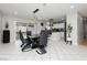Elegant dining area adjacent to kitchen with modern lighting, stylish table, and access to patio at 4492 Rita Dr, Las Vegas, NV 89121