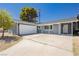 Charming single-story home with a well-maintained front yard and a two-car garage at 4492 Rita Dr, Las Vegas, NV 89121