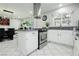Beautiful eat-in kitchen offers stainless steel appliances and bright white cabinets and countertop at 4492 Rita Dr, Las Vegas, NV 89121