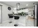 Bright and open kitchen features stainless steel appliances and a breakfast bar with seating at 4492 Rita Dr, Las Vegas, NV 89121