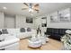 Open-concept living room featuring stylish decor, a fireplace, and ample space at 4492 Rita Dr, Las Vegas, NV 89121