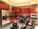 An expansive kitchen features cherry cabinets, stainless appliances, and a large breakfast bar at 4575 Dean Martin Dr # 303, Las Vegas, NV 89103