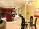 Open-concept space featuring a kitchen with dark wood cabinets and a glass dining table at 4575 Dean Martin Dr # 303, Las Vegas, NV 89103
