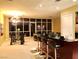 A stylish living space with dining area features a sleek wet bar and abundant natural light at 4575 Dean Martin Dr # 303, Las Vegas, NV 89103