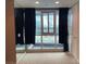Bright bedroom with a modern window and dark floor-to-ceiling curtains framing city views at 4575 Dean Martin Dr # 705, Las Vegas, NV 89103