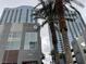 Low angle of a modern condo building with surrounding tropical palm trees at 4575 Dean Martin Dr # 705, Las Vegas, NV 89103