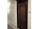 Condo hallway featuring unit 705 and a dark wood door at 4575 Dean Martin Dr # 705, Las Vegas, NV 89103