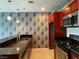 Modern kitchen with stainless steel appliances, dark granite countertops, and stylish pendant lighting at 4575 Dean Martin Dr # 705, Las Vegas, NV 89103