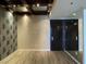Open-concept space featuring stylish wallpaper and wood flooring at 4575 Dean Martin Dr # 705, Las Vegas, NV 89103
