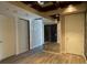 Spacious room featuring hardwood floors with doors and a mirrored wall at 4575 Dean Martin Dr # 705, Las Vegas, NV 89103
