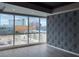 Modern living room with geometric wallpaper and a stunning city view at 4575 Dean Martin Dr # 705, Las Vegas, NV 89103