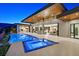 A wonderful outdoor space with pool, hot tub, kitchen, and sliding doors to the house at 49 Crested Cloud Way, Las Vegas, NV 89135