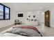 Inviting bedroom with modern décor, comfortable seating and plenty of natural light at 49 Crested Cloud Way, Las Vegas, NV 89135