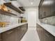 Walk-in pantry with custom cabinetry, ample counter space, and open shelving for storage at 49 Crested Cloud Way, Las Vegas, NV 89135